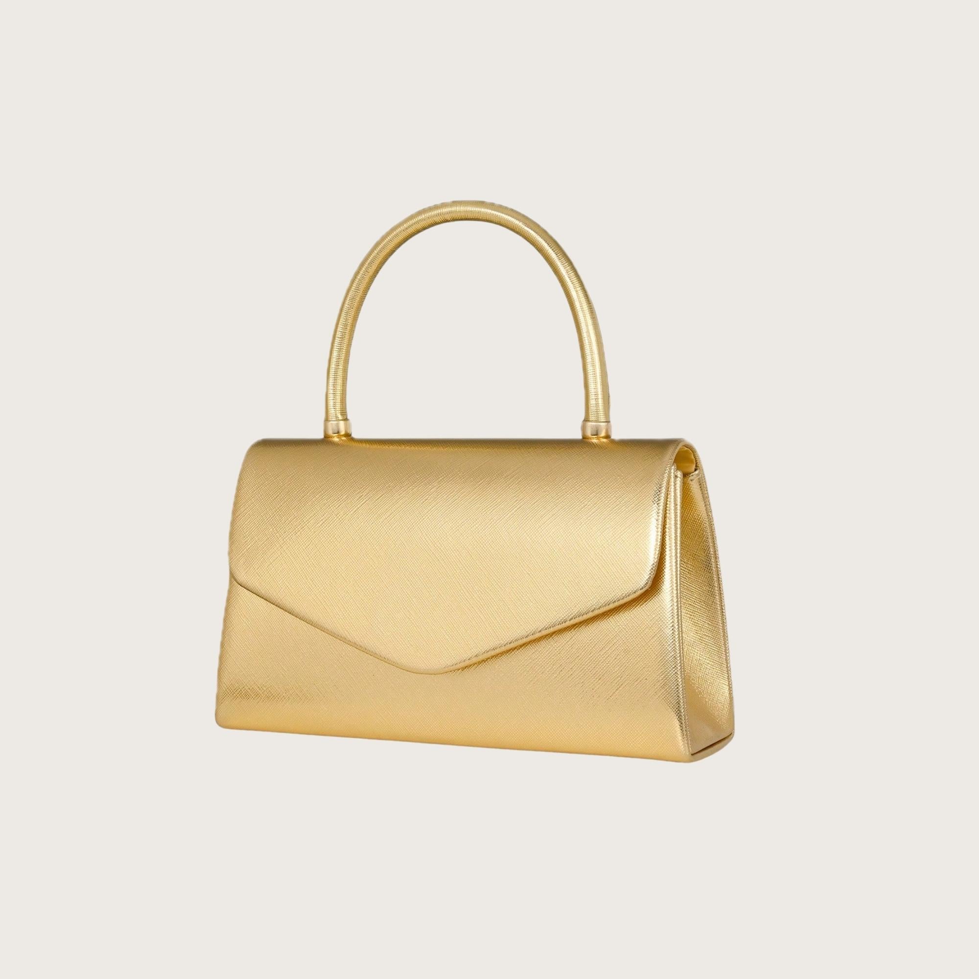 Gold handbag on a light beige background